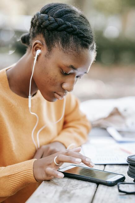 Young girl with I phone and earbud